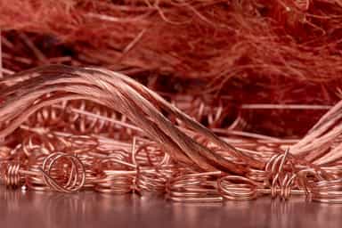 Copper hovers near one-week high, tin pulls back from record
