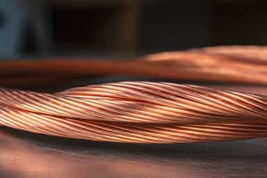 Copper edges up on softer US dollar ahead of expected Fed rate cut